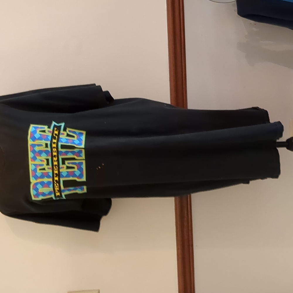 Jerzees long pajama top with front graphic accent.